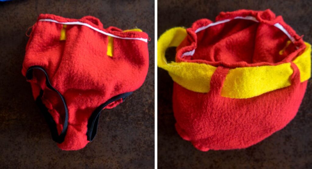 Dos vistas de unos calzoncillos caseros de Superman hechos con tela polar roja, con cinturón amarillo y goma elástica en la cintura y las perneras.