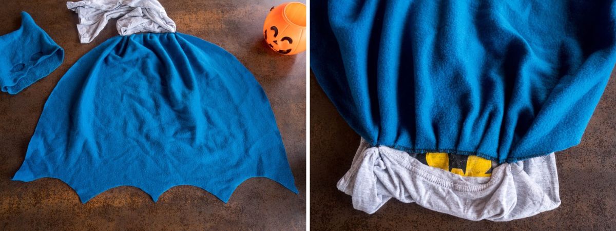 Capa casera de Batman hecha con tela polar azul, con el borde recortado en forma de alas de murciélago y la parte superior fruncida.